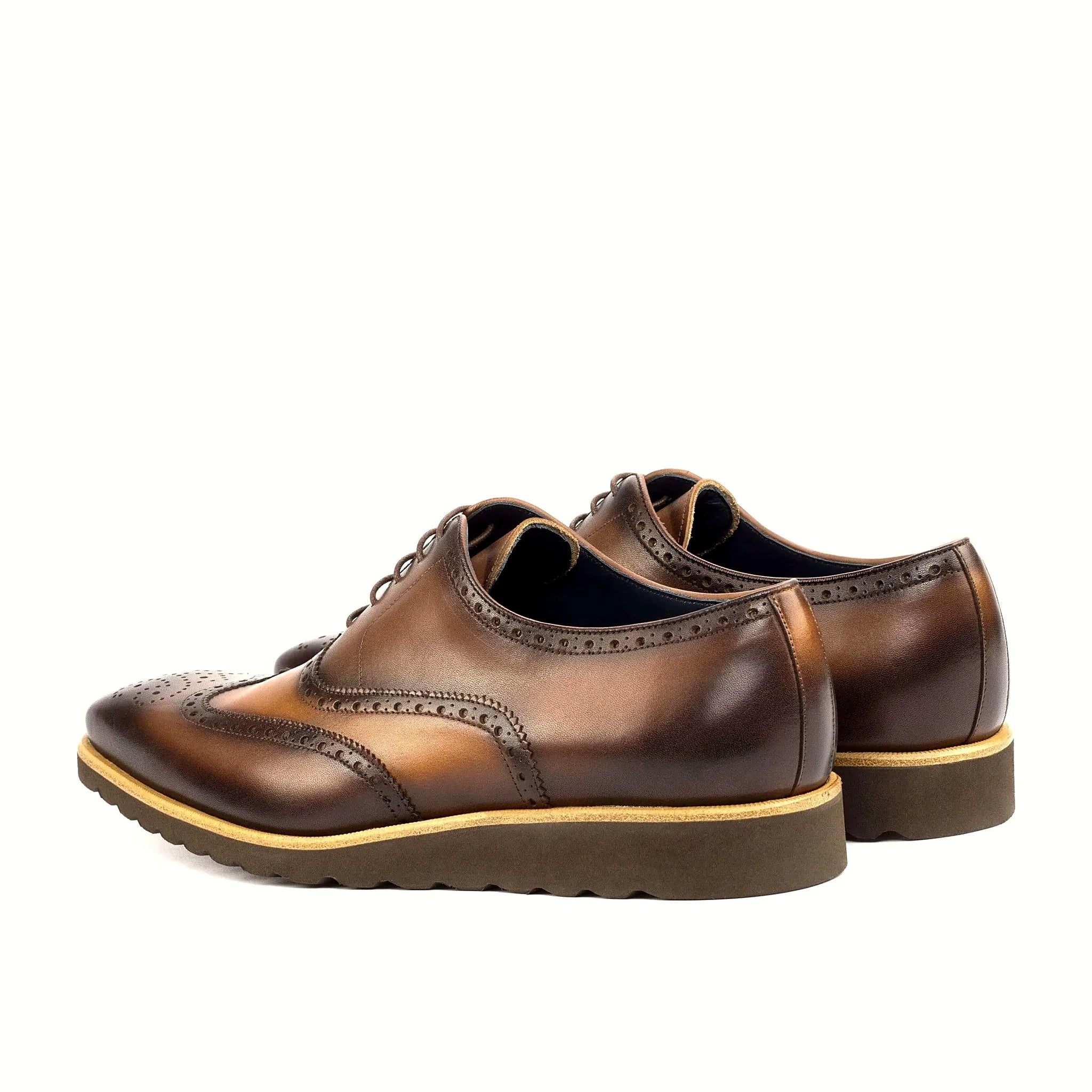 Brogue perforation crossing both shades