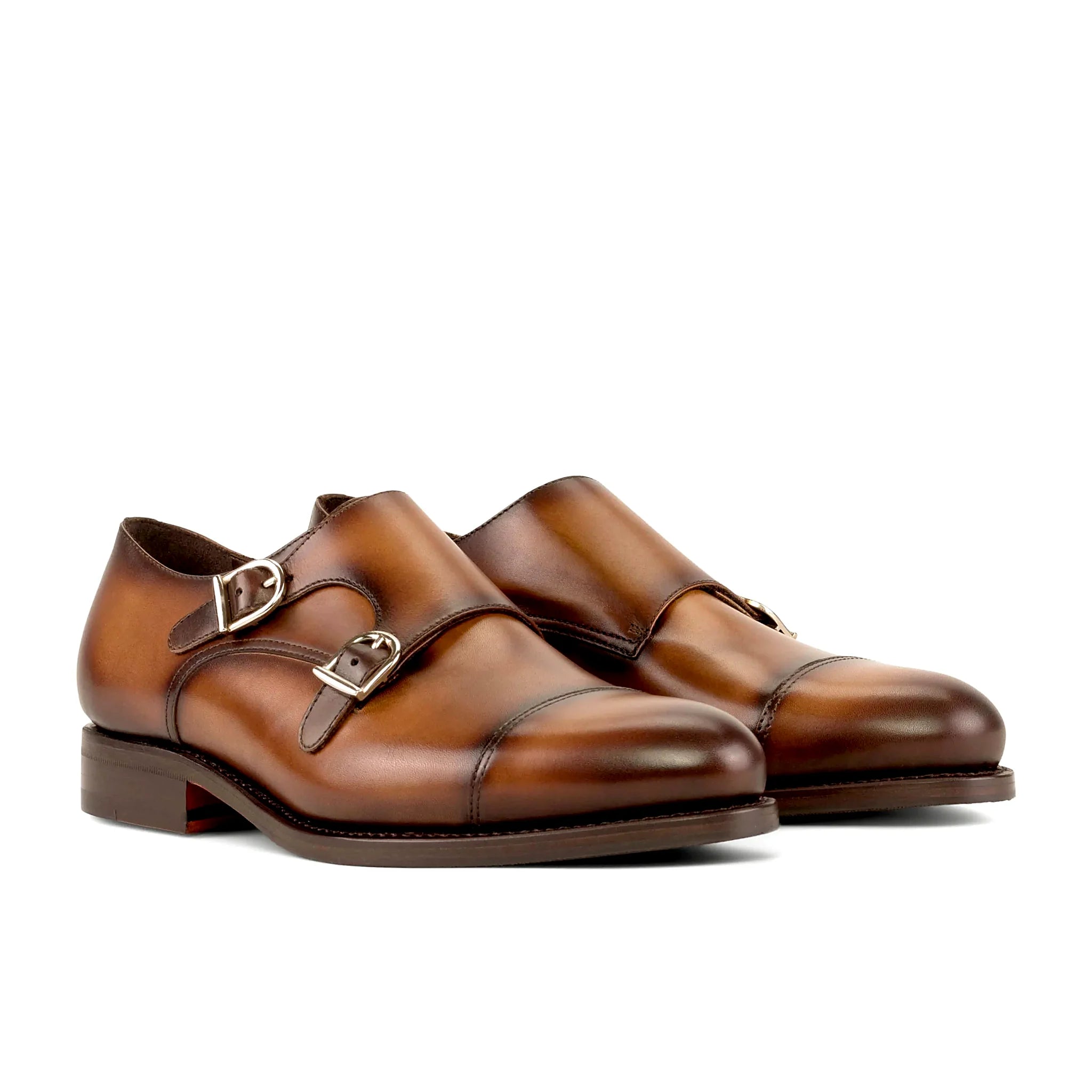 Two straps crossing the burnished calf