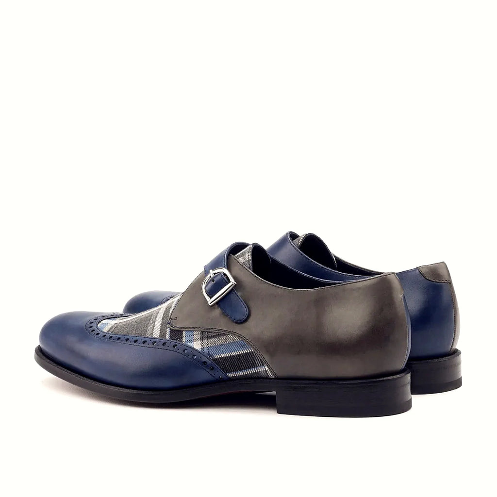 Grey painted calf beside the plaid