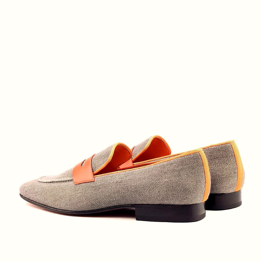 Orange grossgrain against the grey linen