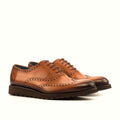 Burnished cognac shading at the toe and heel
