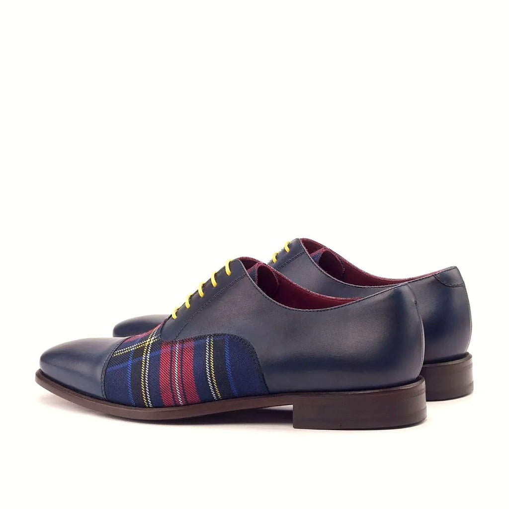Navy painted calf beside the tartan