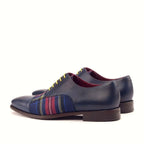 Navy painted calf beside the tartan