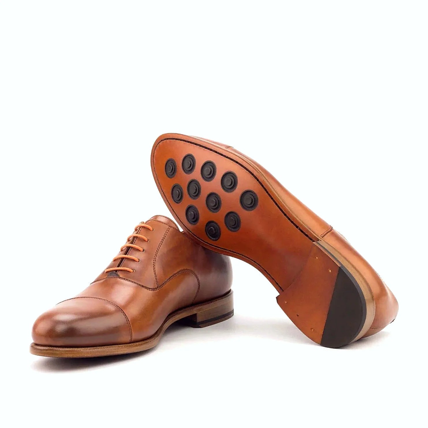 Leather sole with buttons rubber injections