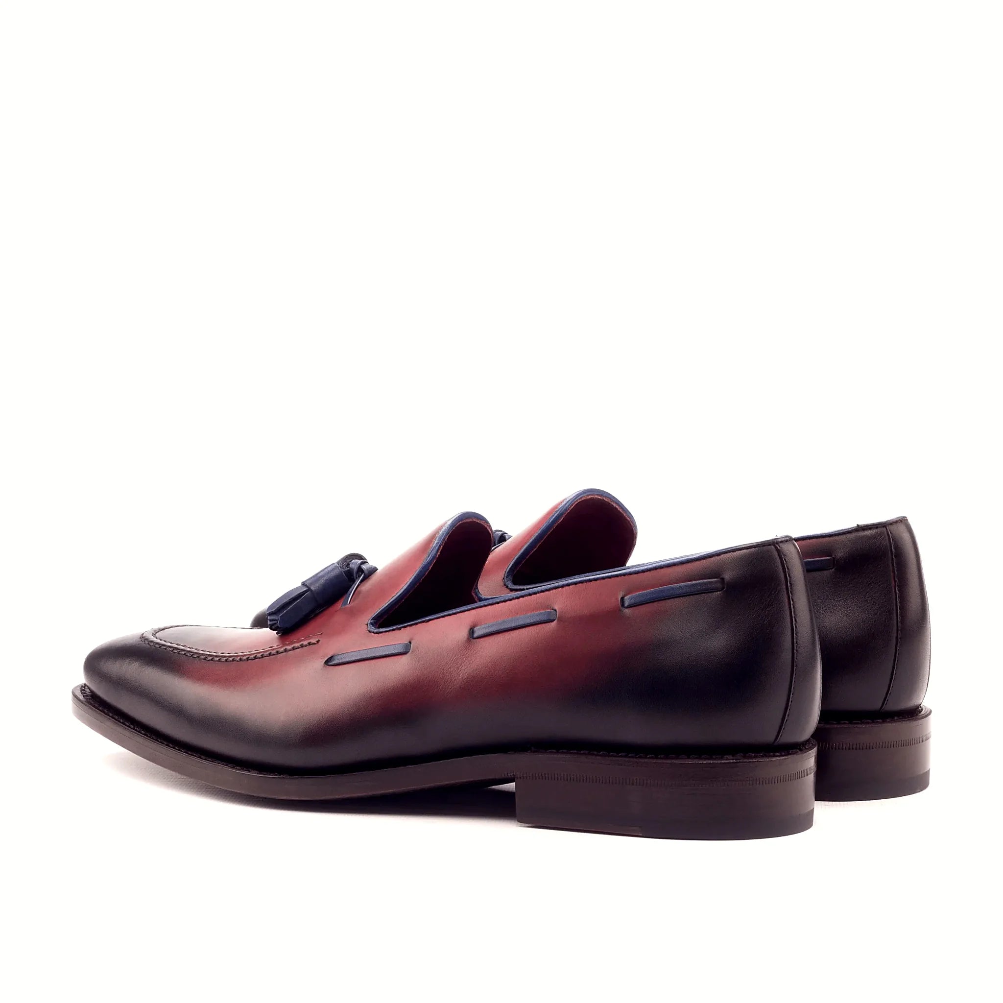 Burnished red deepening where the shoe curves