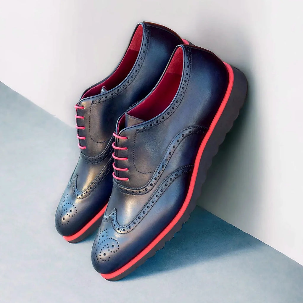 Navy painted calf brogue across the upper