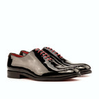 Black patent wholecut with closed channel lacing