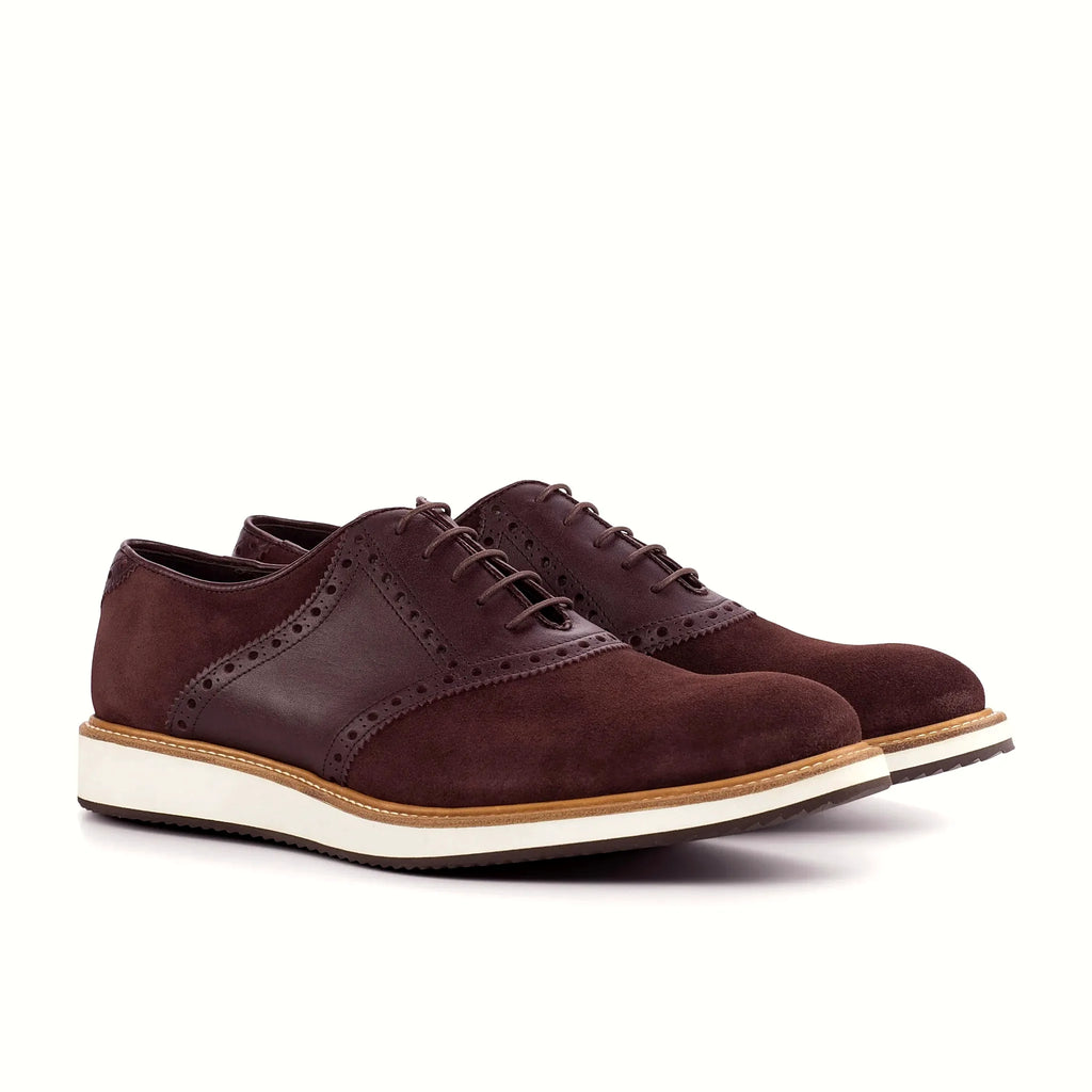 Burgundy suede saddle across the lace area